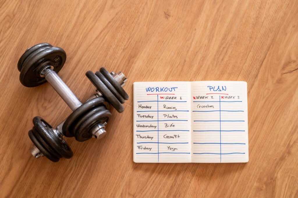 Weekly home workout schedule with strength, light, and rest days for beginners